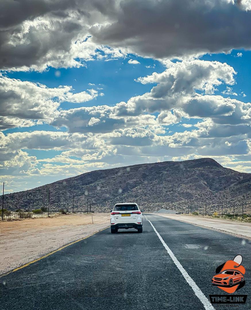 Time-Link Fortuner on the open road through the Namibian landscape